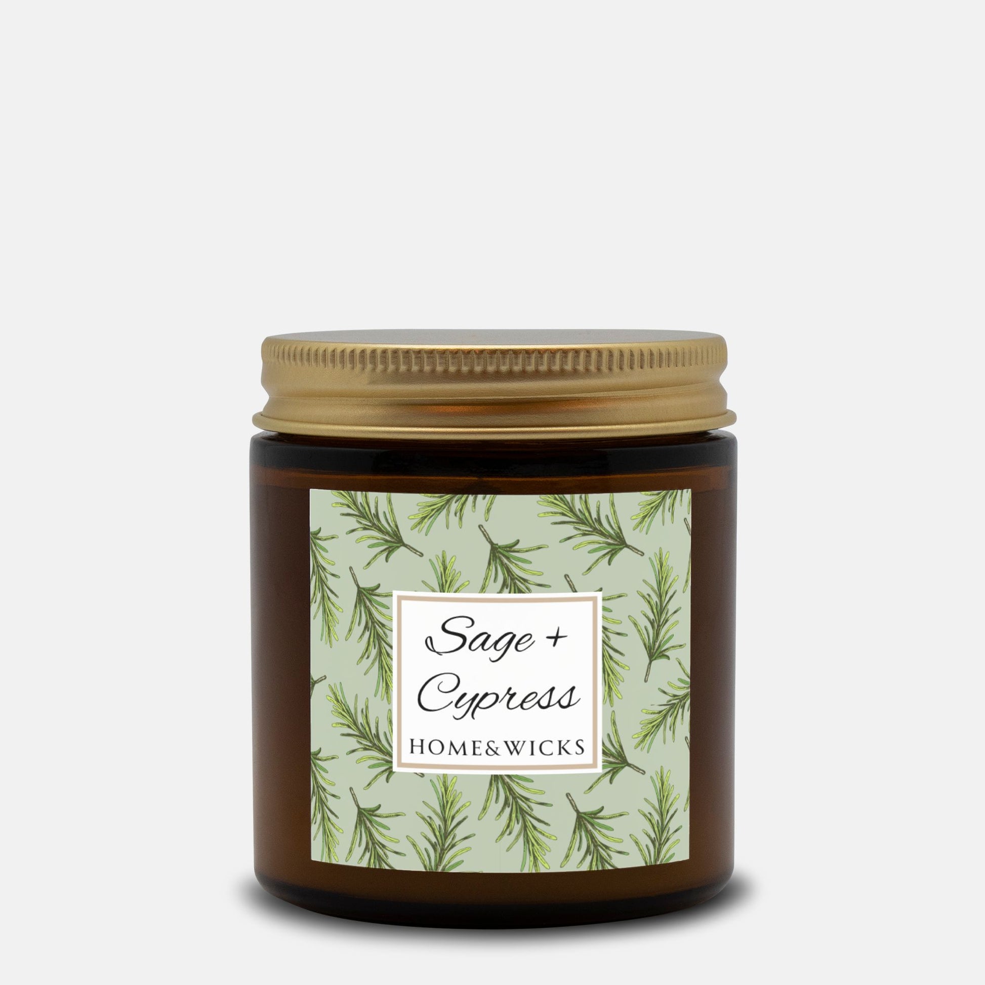 Sage & Cypress candle in a 4 oz. amber glass jar with a gold lid and 'Sage + Cypress' label on a white background by Home & Wicks