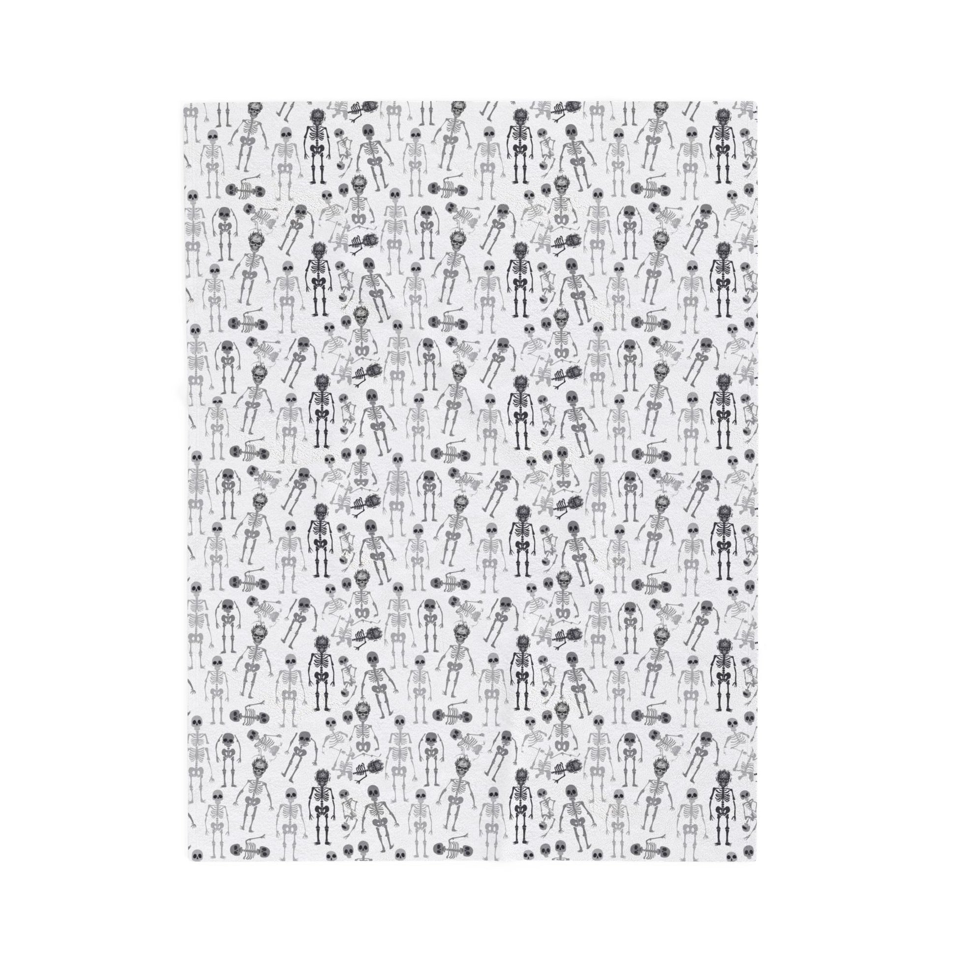 Halloween-themed Skeletons patterned blanket with black and white skeletons on a white background on front of blanket, on a white background