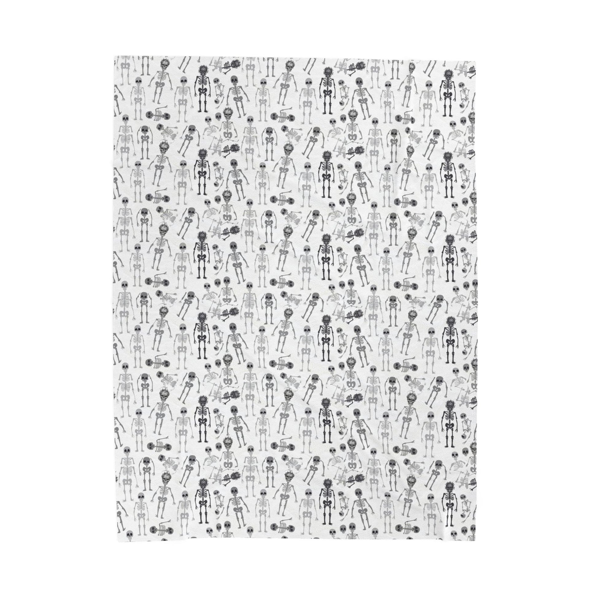 Halloween-themed Skeletons patterned blanket with black and white skeletons on a white background on front of blanket, on a white background