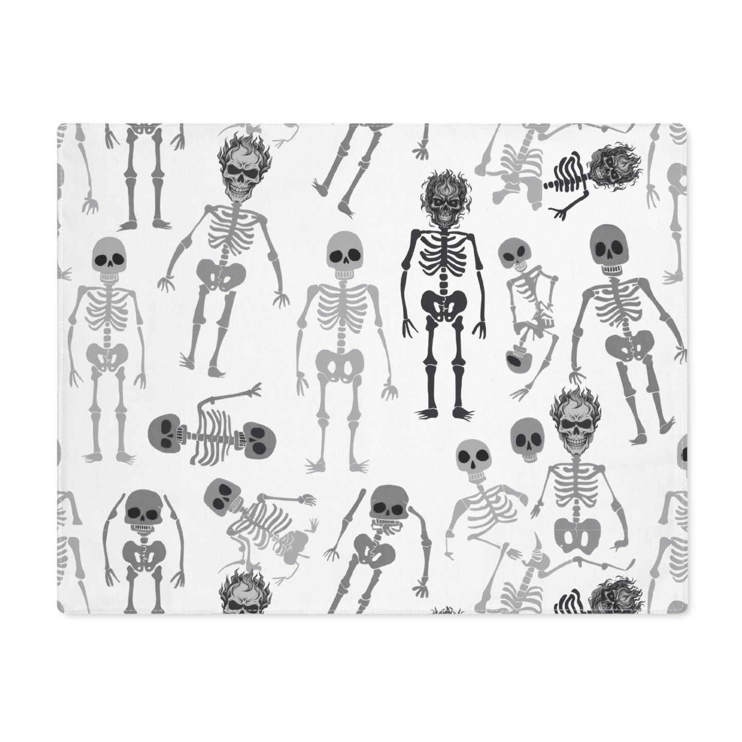 Skeletons placemat with black and white skeleton pattern on front of placemat, on a white background