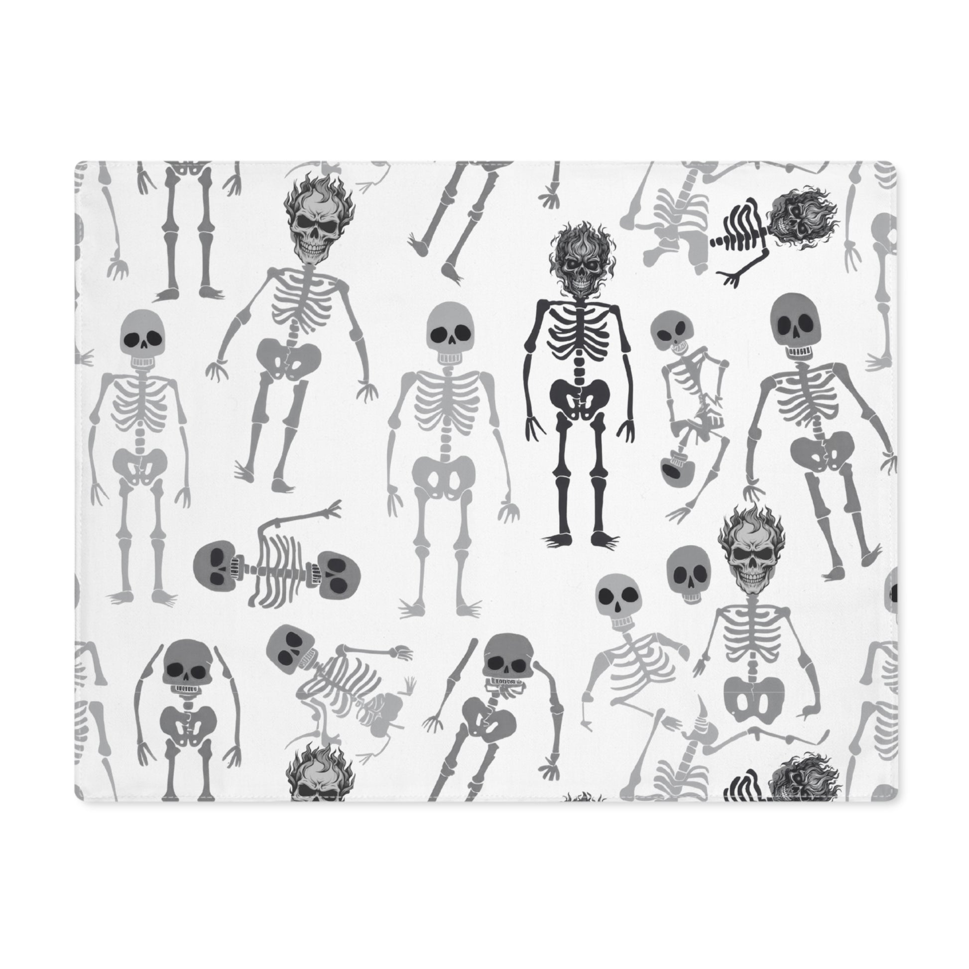 Skeletons placemat with black and white skeleton pattern on front of placemat, on a white background