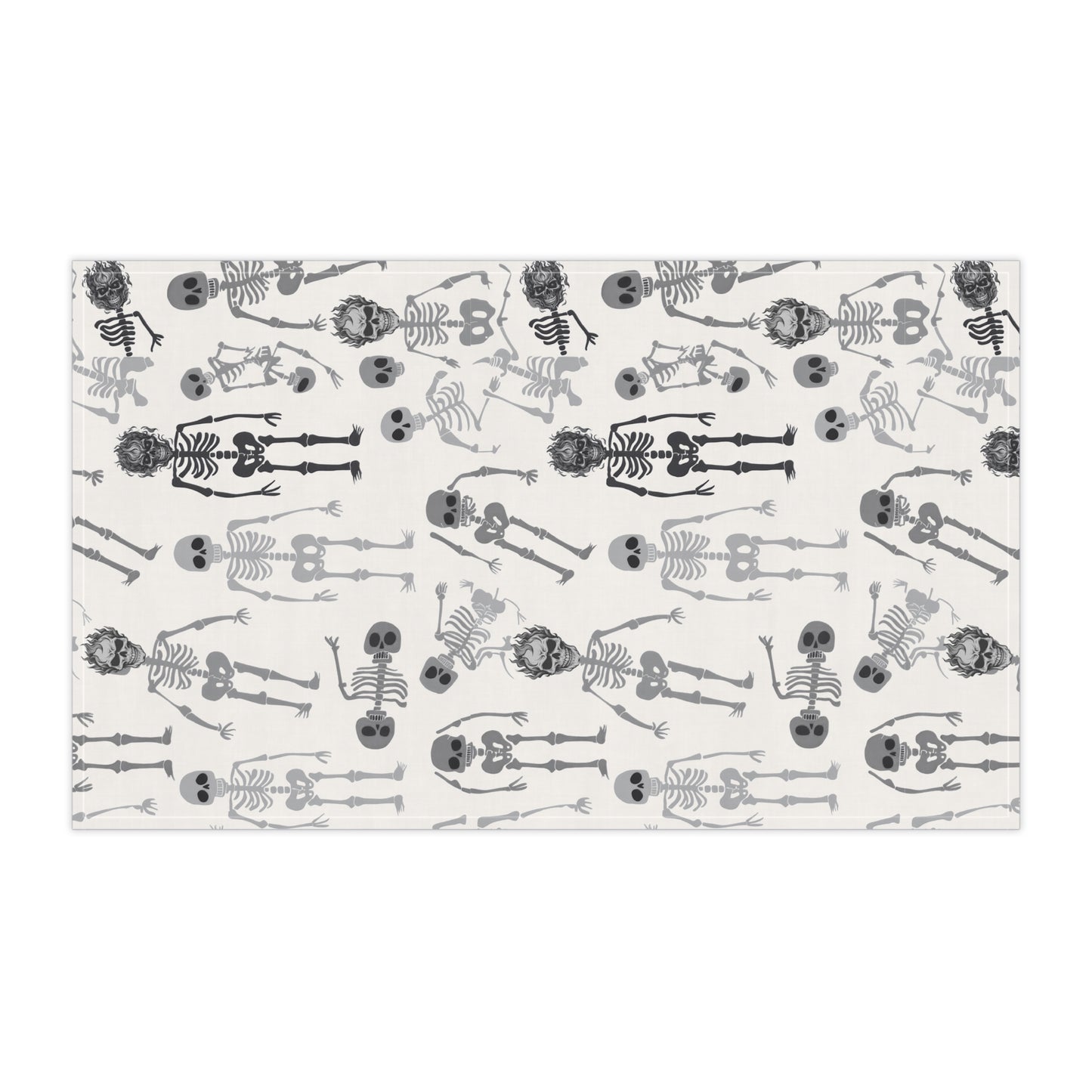 Skeletons tea kitchen towel with black and white skeleton pattern on front of towel, on a white background