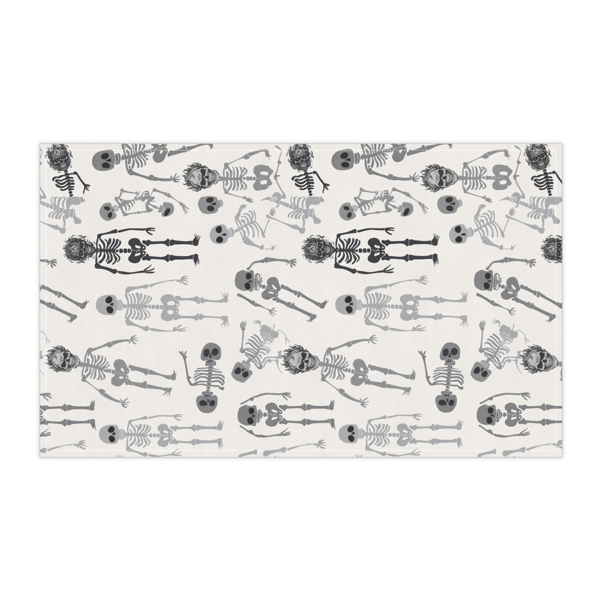 Skeletons tea kitchen towel with black and white skeleton pattern on front of towel, on a white background
