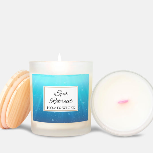 Candle with pink wood wick and a 'Spa Retreat' label by Home & Wicks on a white background
