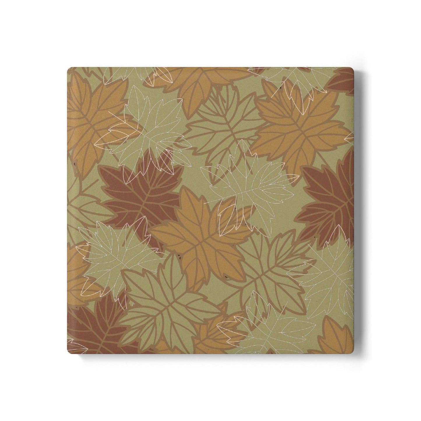 Square ceramic tile coaster with autumn leaf pattern on a green background