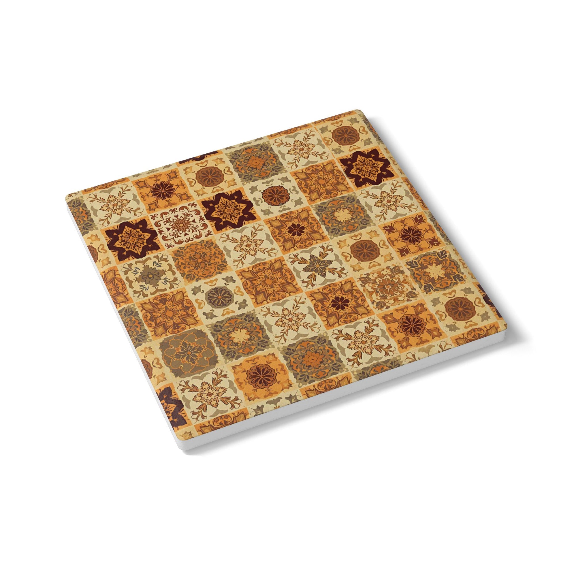 Decorative square ceramic tile coaster with a pattern of squares and brown, gold and green-gray floral designs on a white background