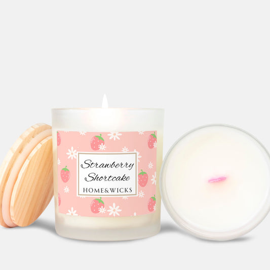 Candle with pink wood wick and a 'Strawberry Shortcake' label on a white background