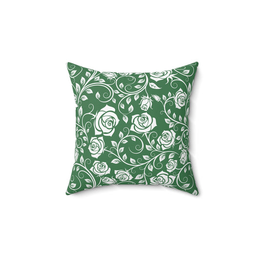 Decorative pillow with white rose pattern on a green background