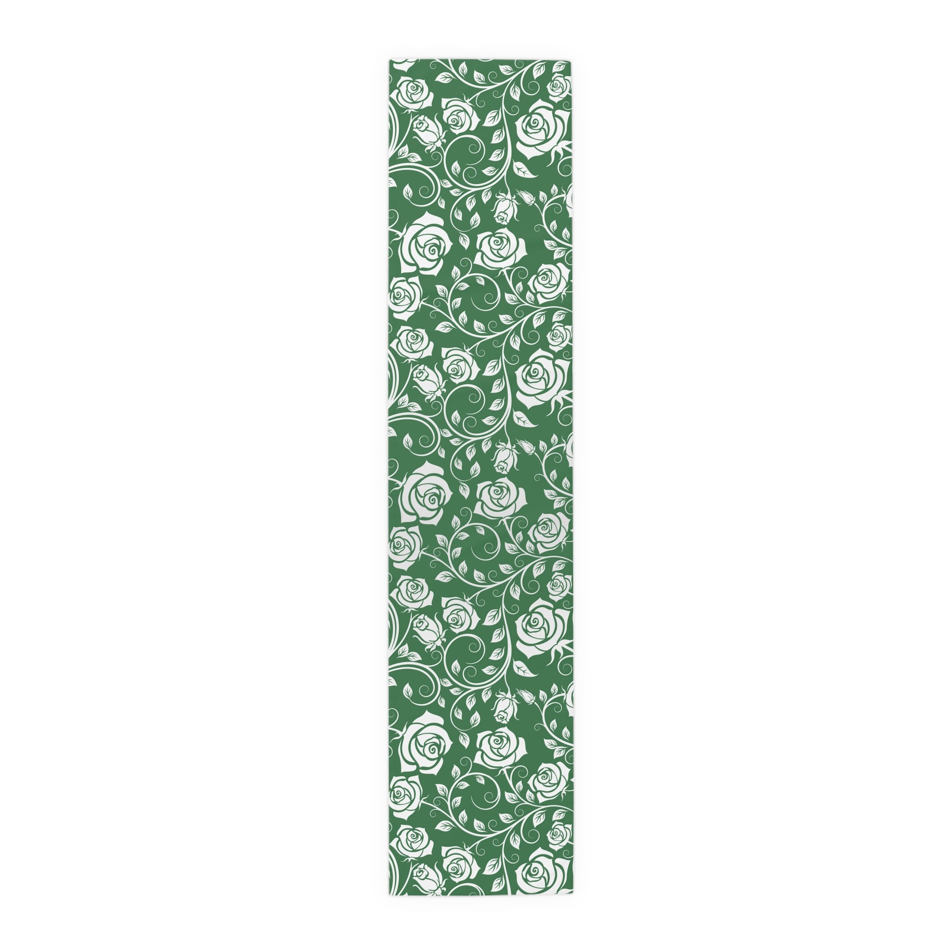 Table runner with white floral pattern on a green background on a white background