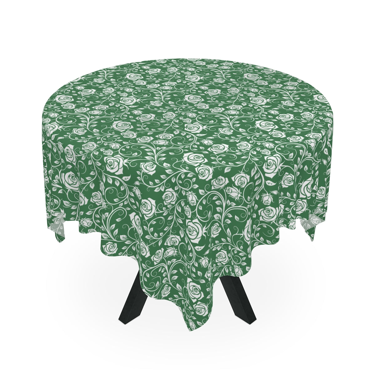 Round table with a green and white floral patterned tablecloth on a white background