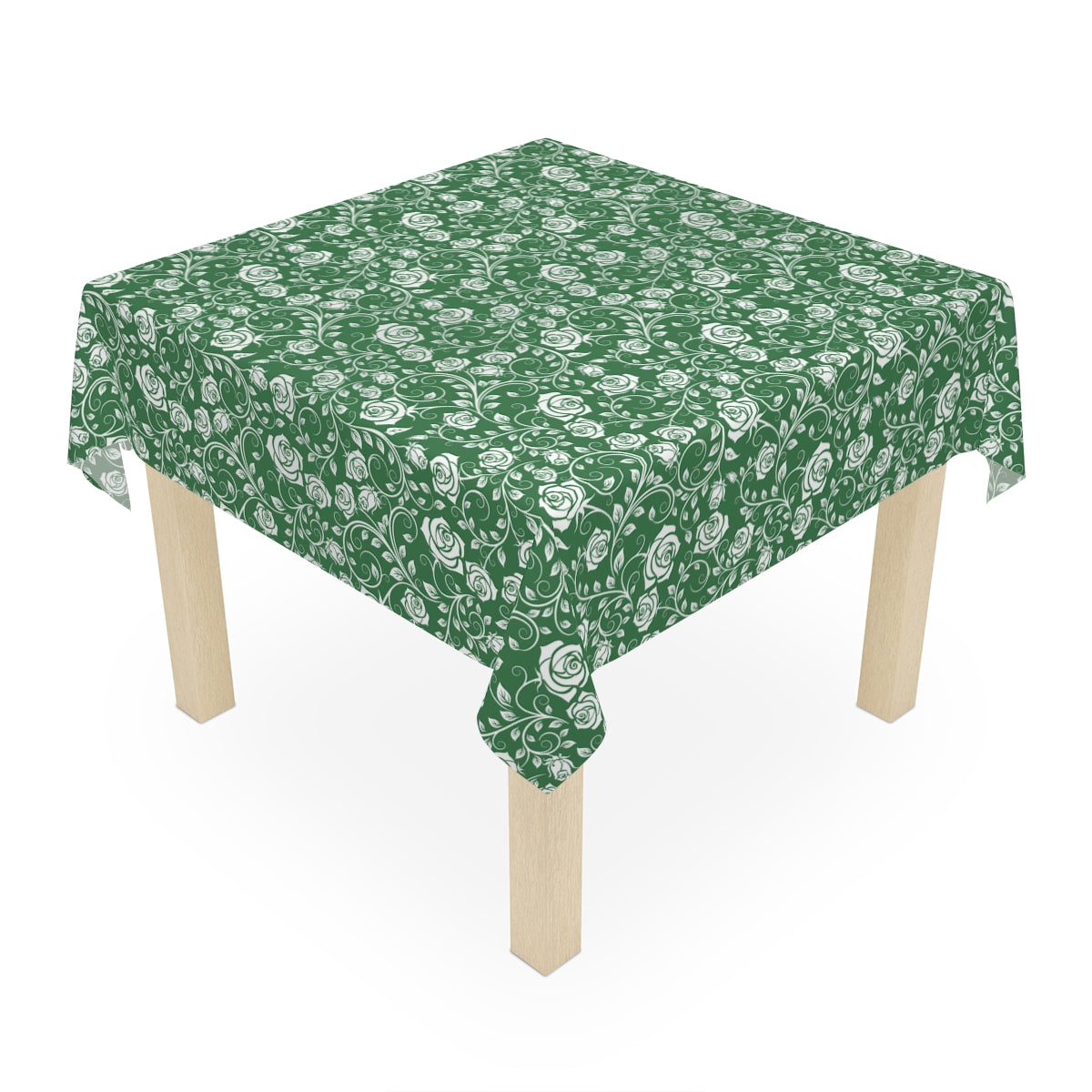 Green and white floral patterned tablecloth on a wooden table