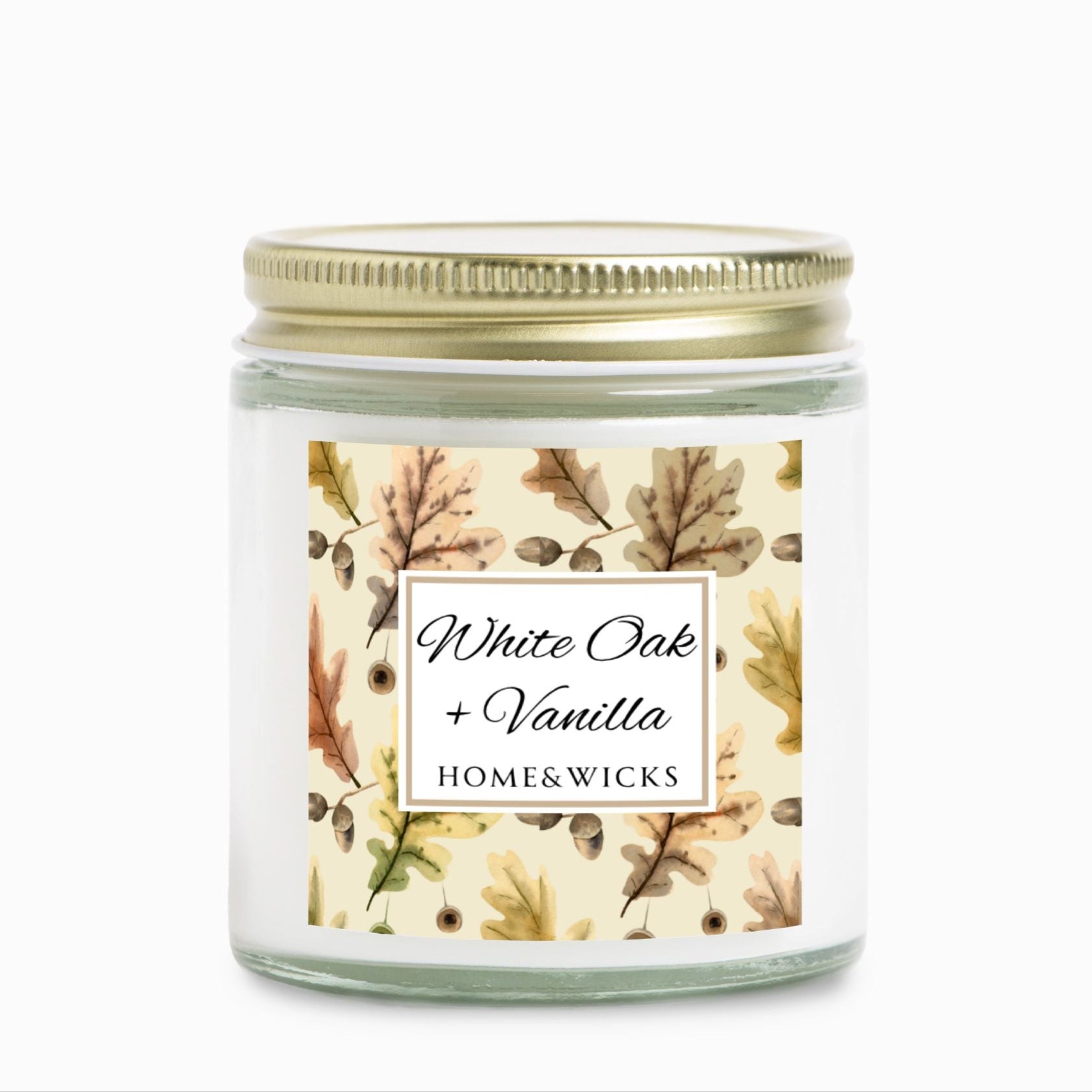 White Oak & Vanilla candle in a 4 oz. clear jar and gold lid with a decorative oak leaf design label featuring leaves and the brand 'Home & Wicks'.