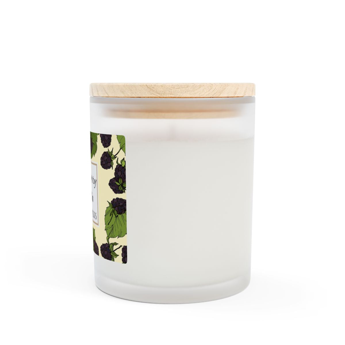 Side view of wood wick Blackberry Vanilla candle with a label featuring blackberries and leaves image on a white background by Home & Wicks