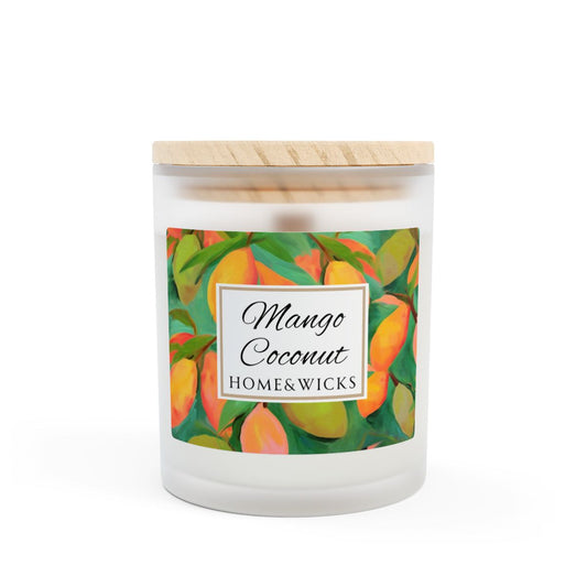 Wood wick candle with a green and orange mango coconut label on a frosted glass candle jar on a white background by Home & Wicks