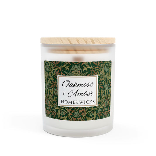 Wood wick Oakmoss & Amber candle  in a frosted glass jar with a green decorative label featuring the illustration by William Morris "Flower Garden" on a white background by Home & Wicks