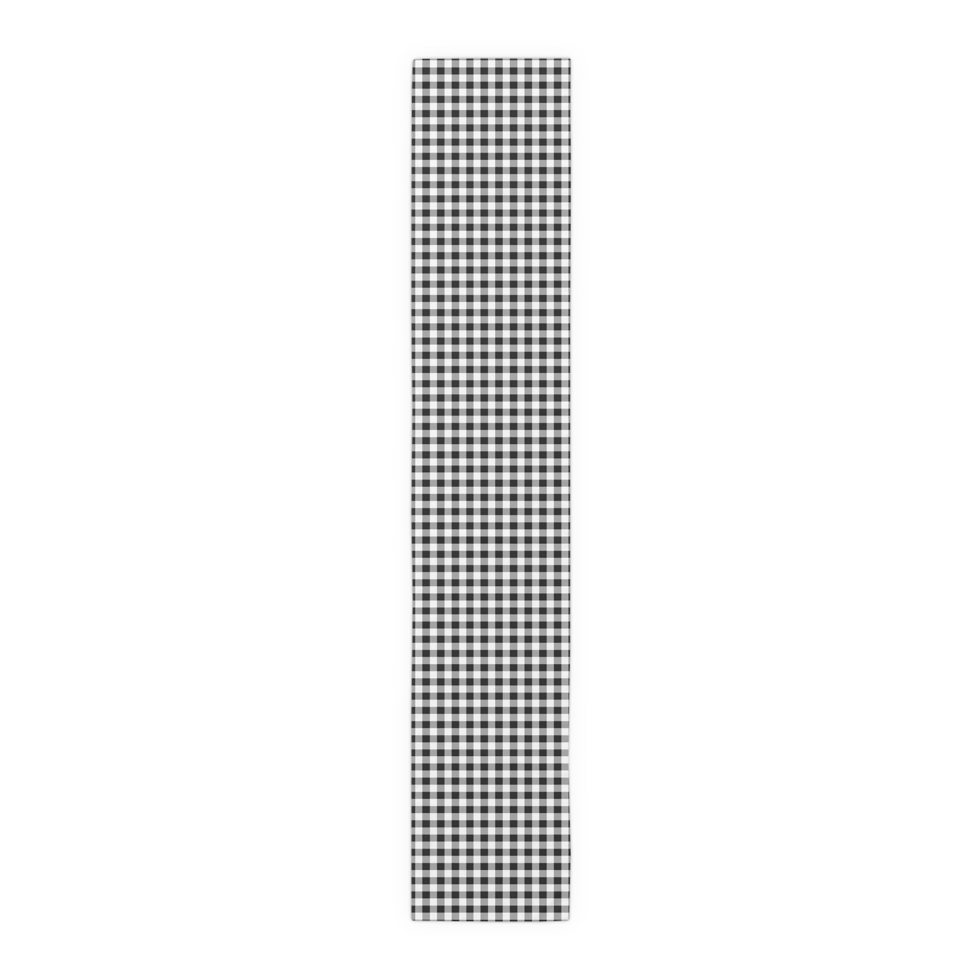 Black and white checkered gingham table runner on a white background
