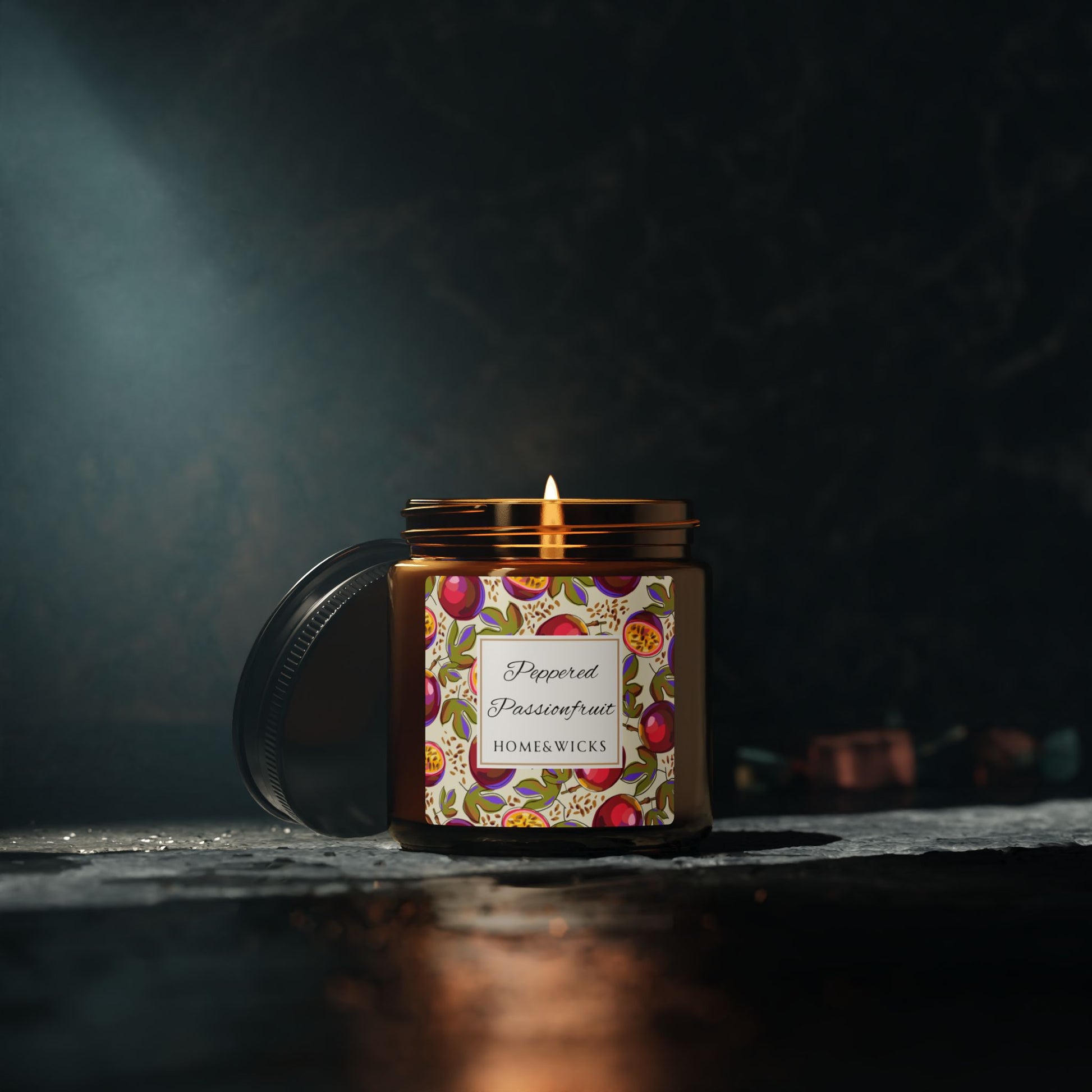 Candle in a decorative jar with a colorful label on a dark background